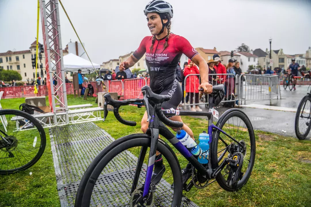 Woman next to bike during Escape from Alcatraz Triathlon 