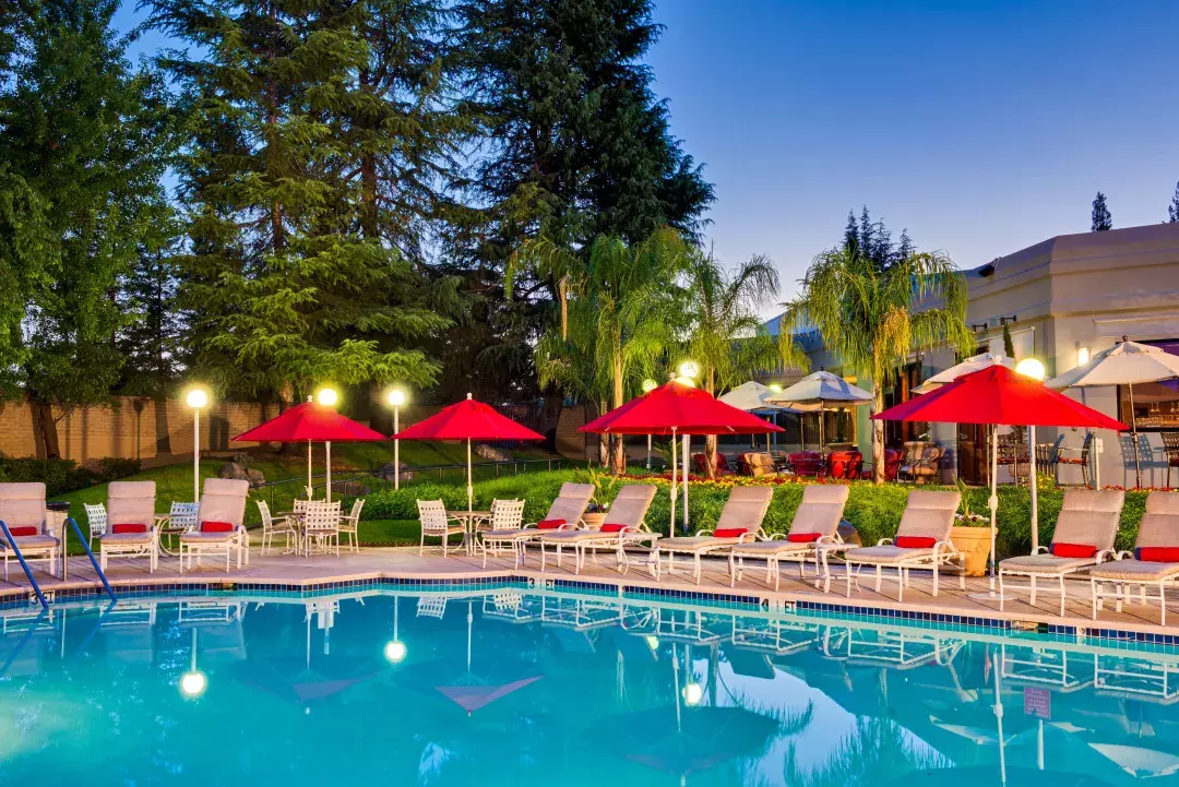 Pool next to outdoor furniture