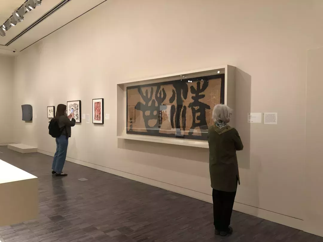 Guests explore the Asian Art Musem's collection.