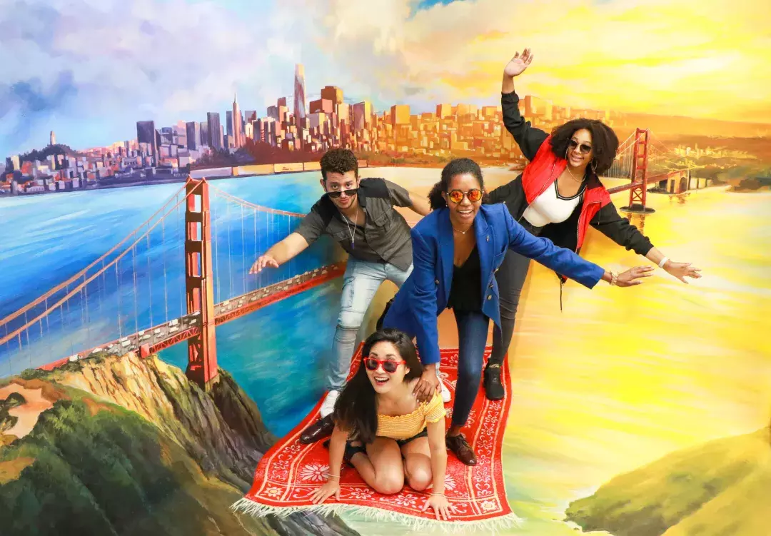 Friends pose for photos at the Museum of 3D Illusions