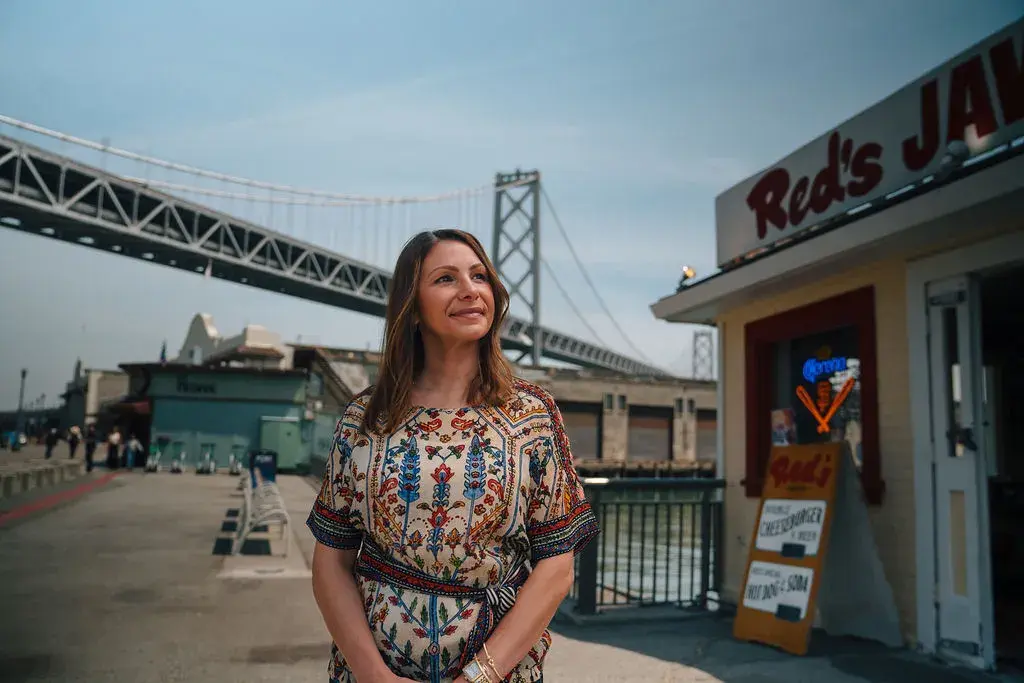 Tiffany Pisoni, owner of Red's Java House, stands outside her restaurant