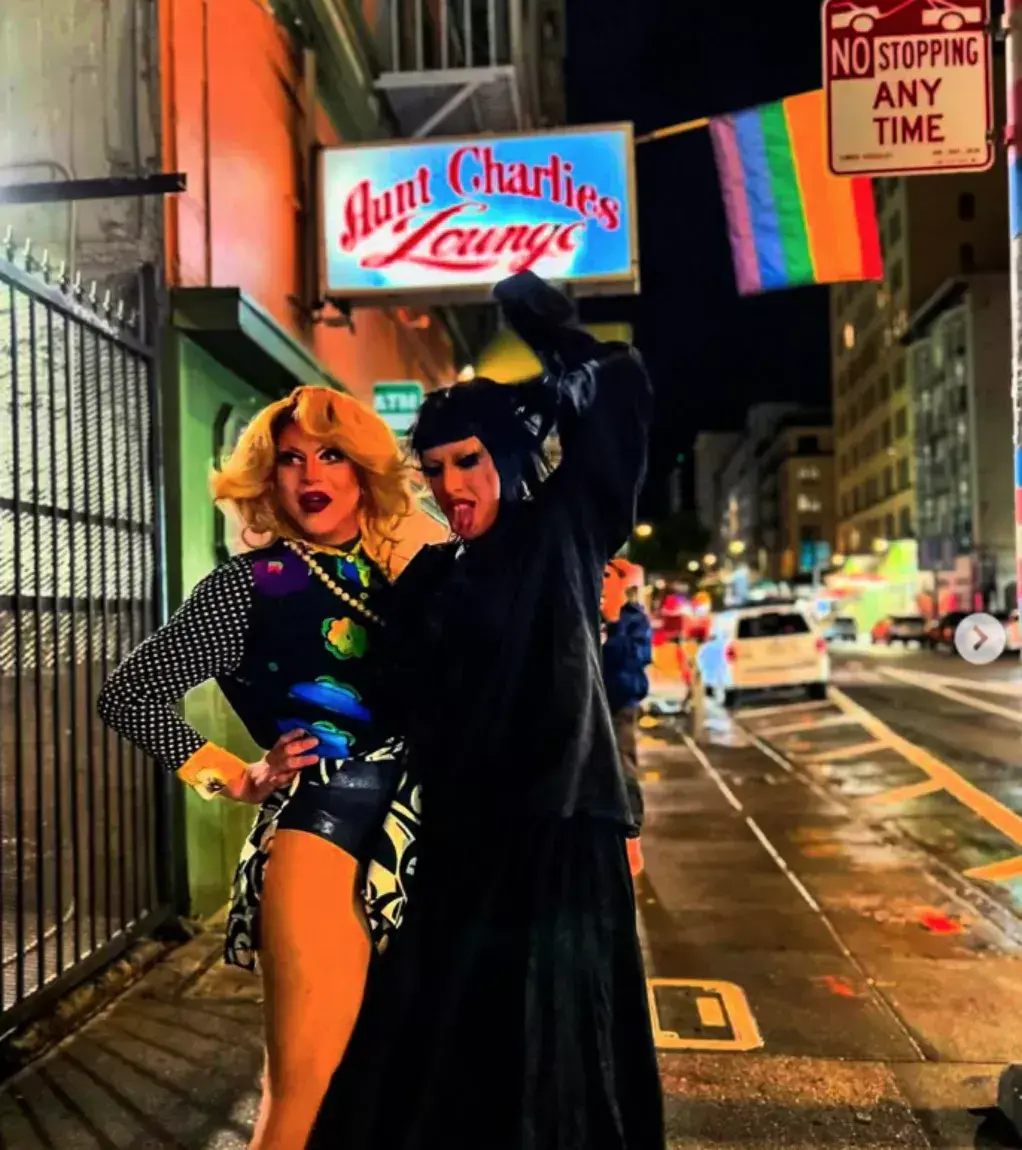Drag queens standing outside of Aunt Charlies Bar in the Tenderloin. 