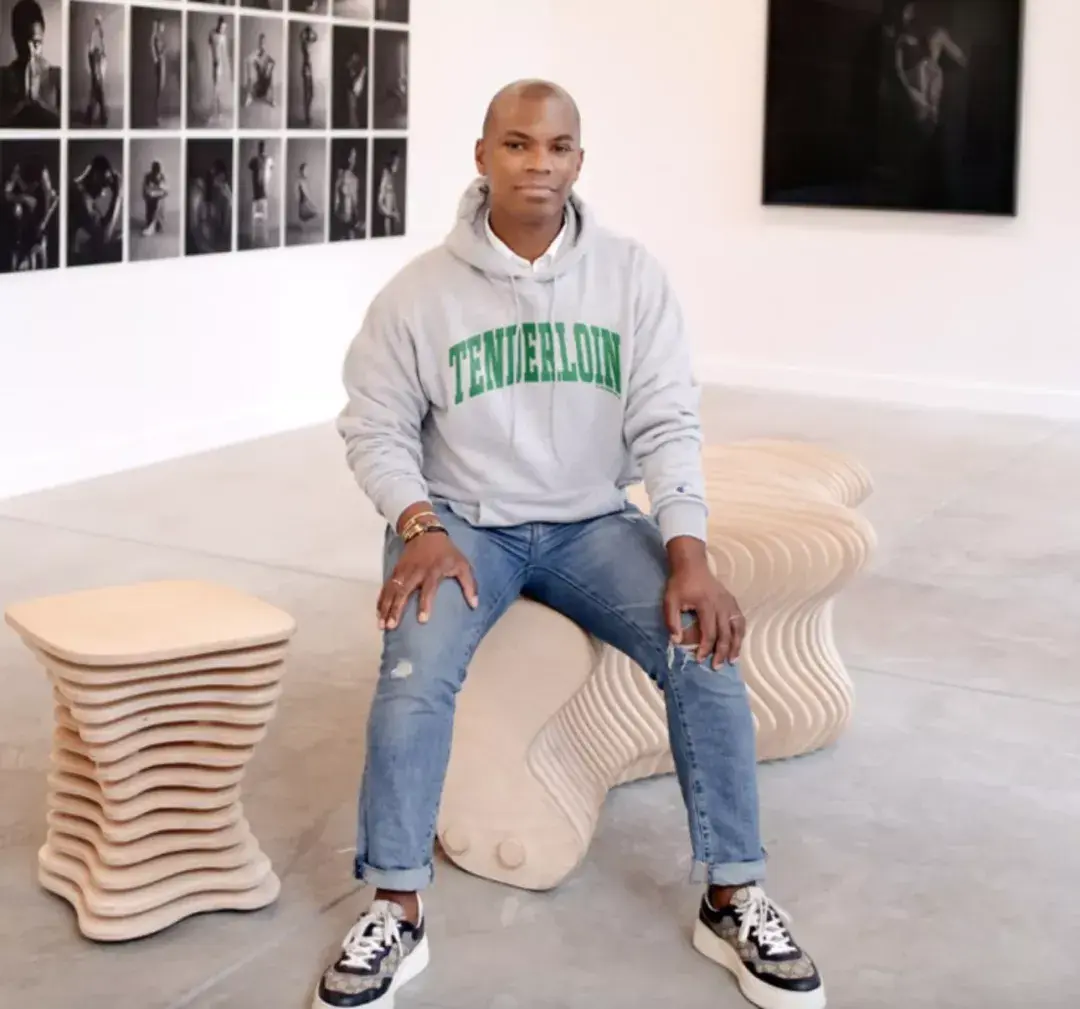Johnathan Carver Moore sitting in his gallery