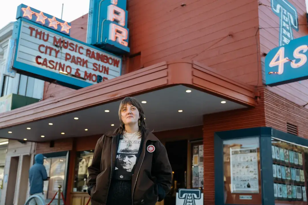 Sydney Peterson, general manager of the Four Star Theater, stands outside the Richmond District establishment.