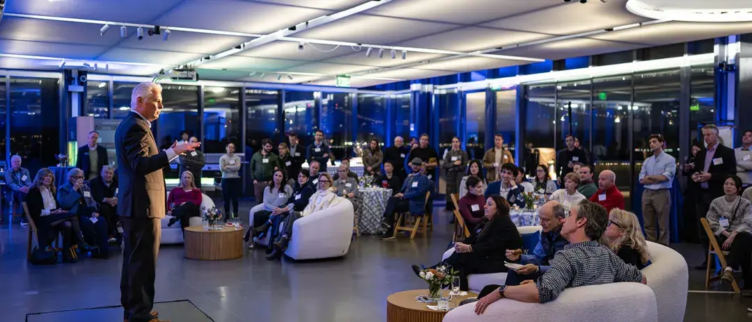 Guests listen to a speaker at an event held at San Francisco's Exploratorium.
