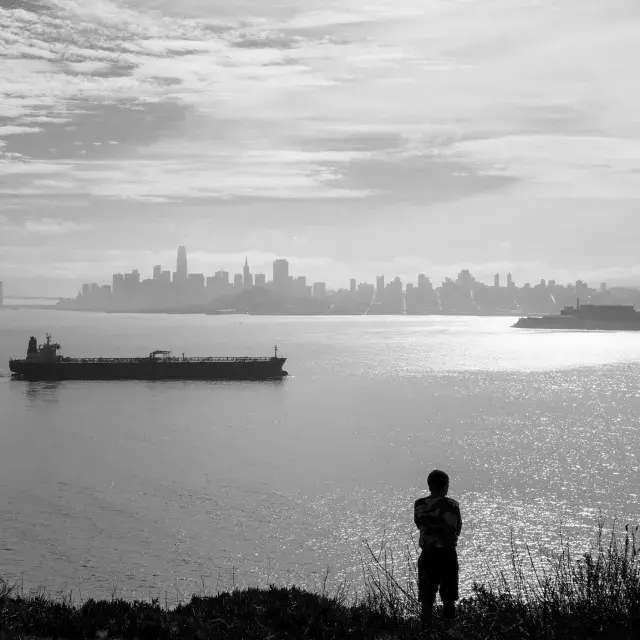 A visitor enjoys the wide views from Angel Island