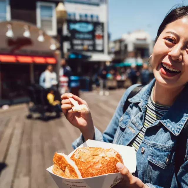 Woman with chowder at PIER 39