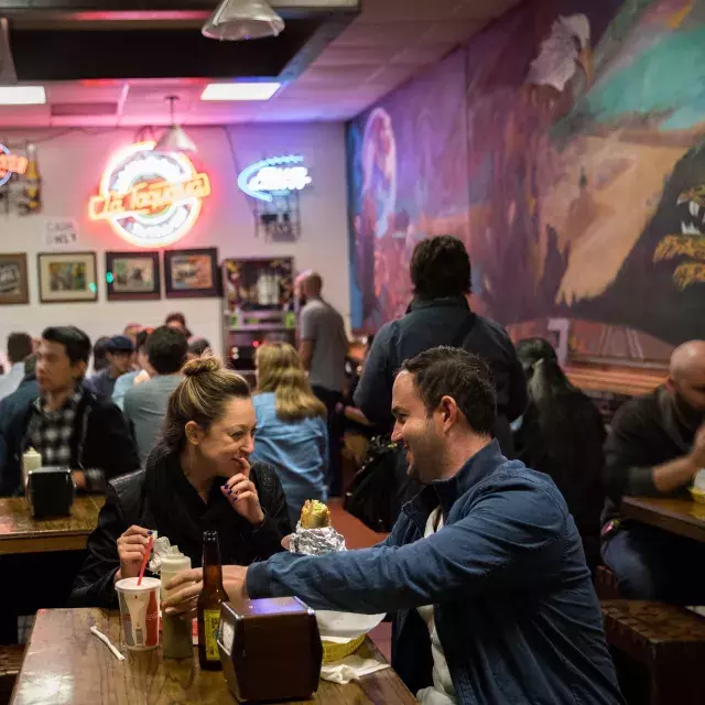 Visitors enjoy authentic Mexican food in San Francisco's Mission neighborhood.