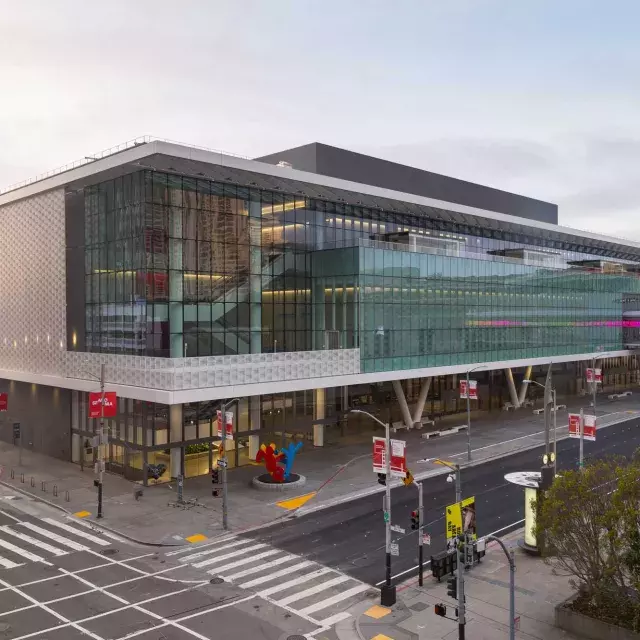 A wide shot of the glassy, modern Moscone Center South building.