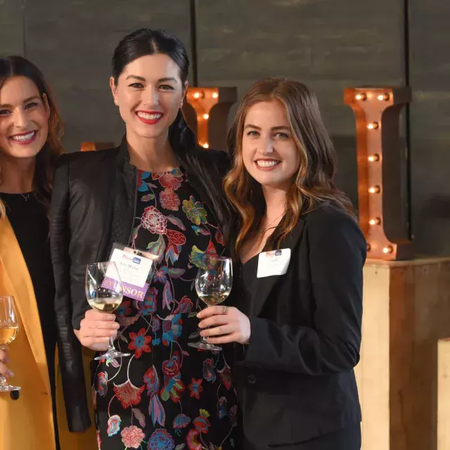 People posing for a photo at a Partner Business Exchange