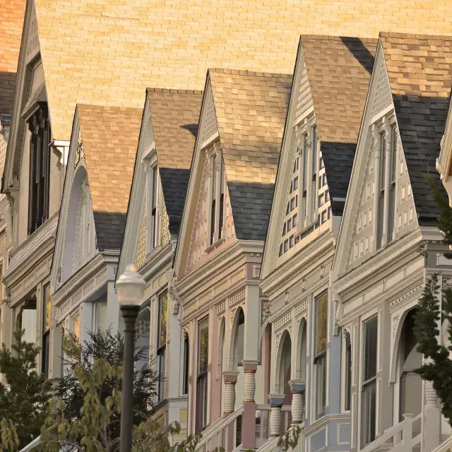 Close up of a row of Victorian houses in the Castro district of San Francisco.