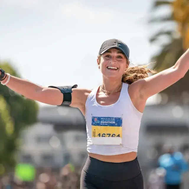 A woman finishes running the San Francisco Marathon