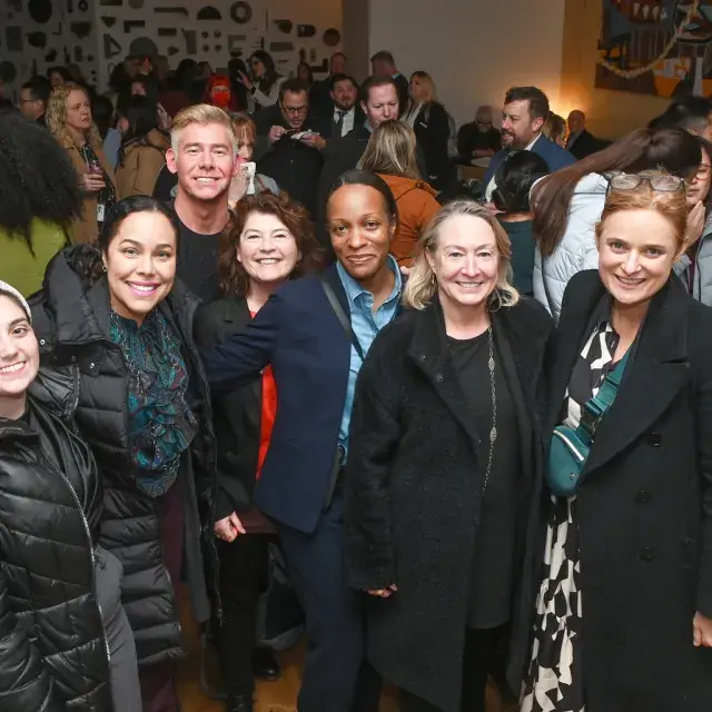Staff and members gather at an official San Francisco Travel event.