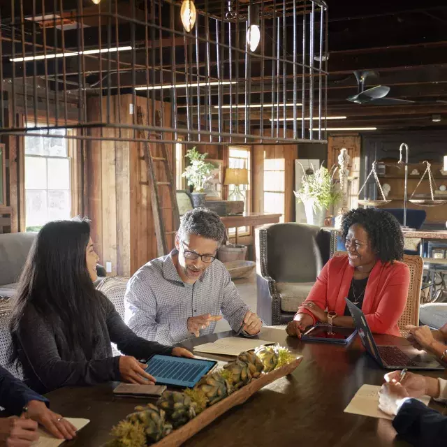 A group collaborates at a meeting in Monterey.