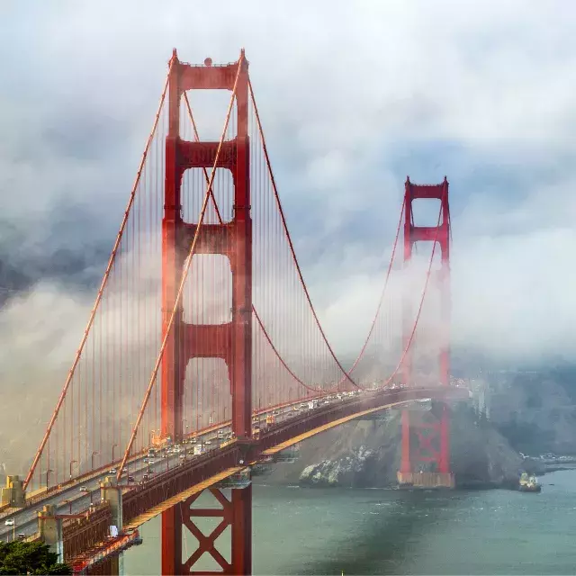 Golden Gate Bridge peaking out from behind the fog