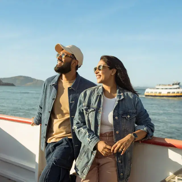 Couple looking off into the distance while cruising on the bay