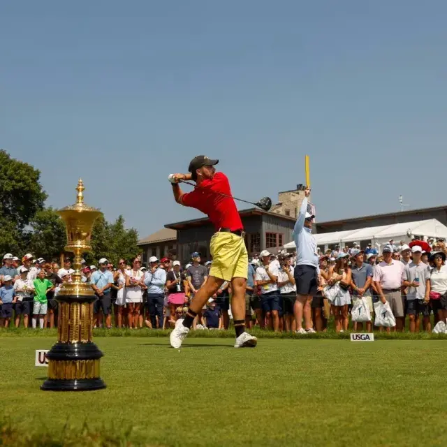 Spectators watch from the fairway at the USGA Amateur Championship.