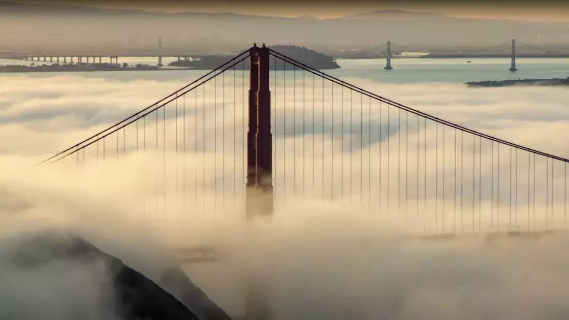 Shot of the Golden Gate Bridge as fog envelops it.